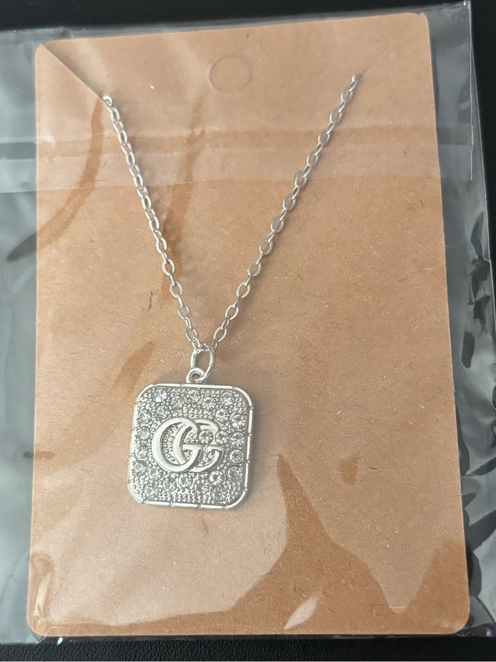 Upcycled charm w/unbranded chain